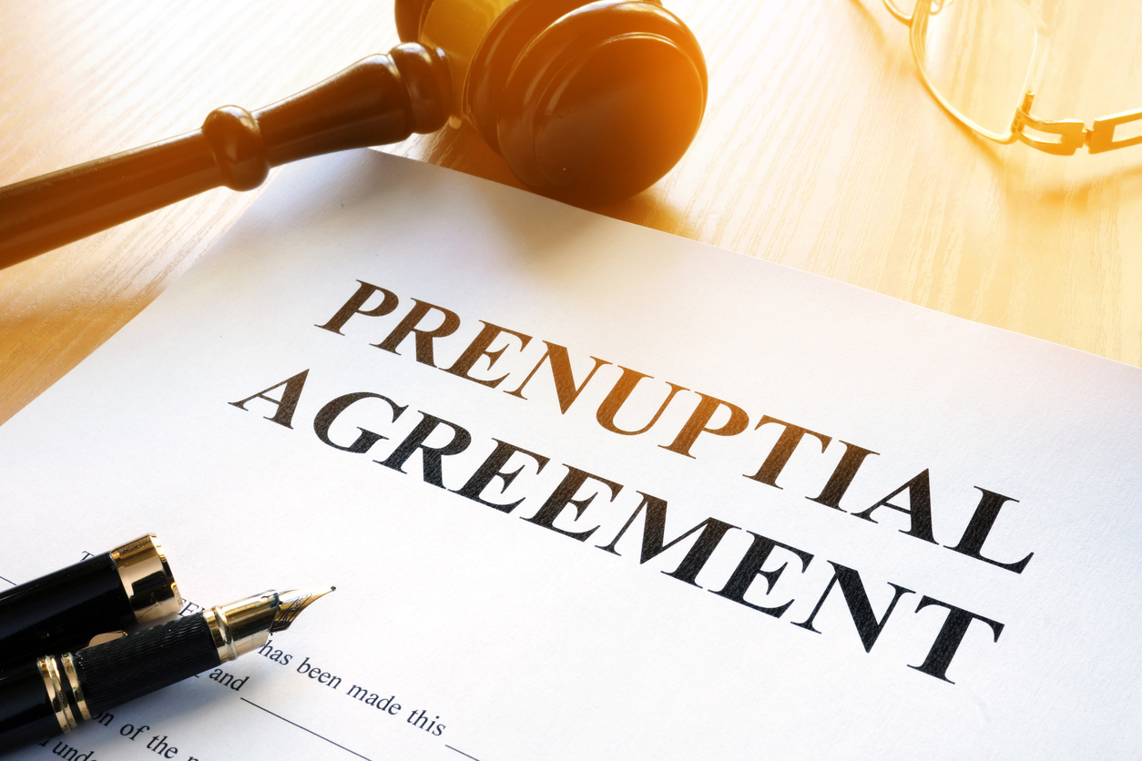 Prenuptial Agreement on a table - Document Preparation with Karen Fischer.