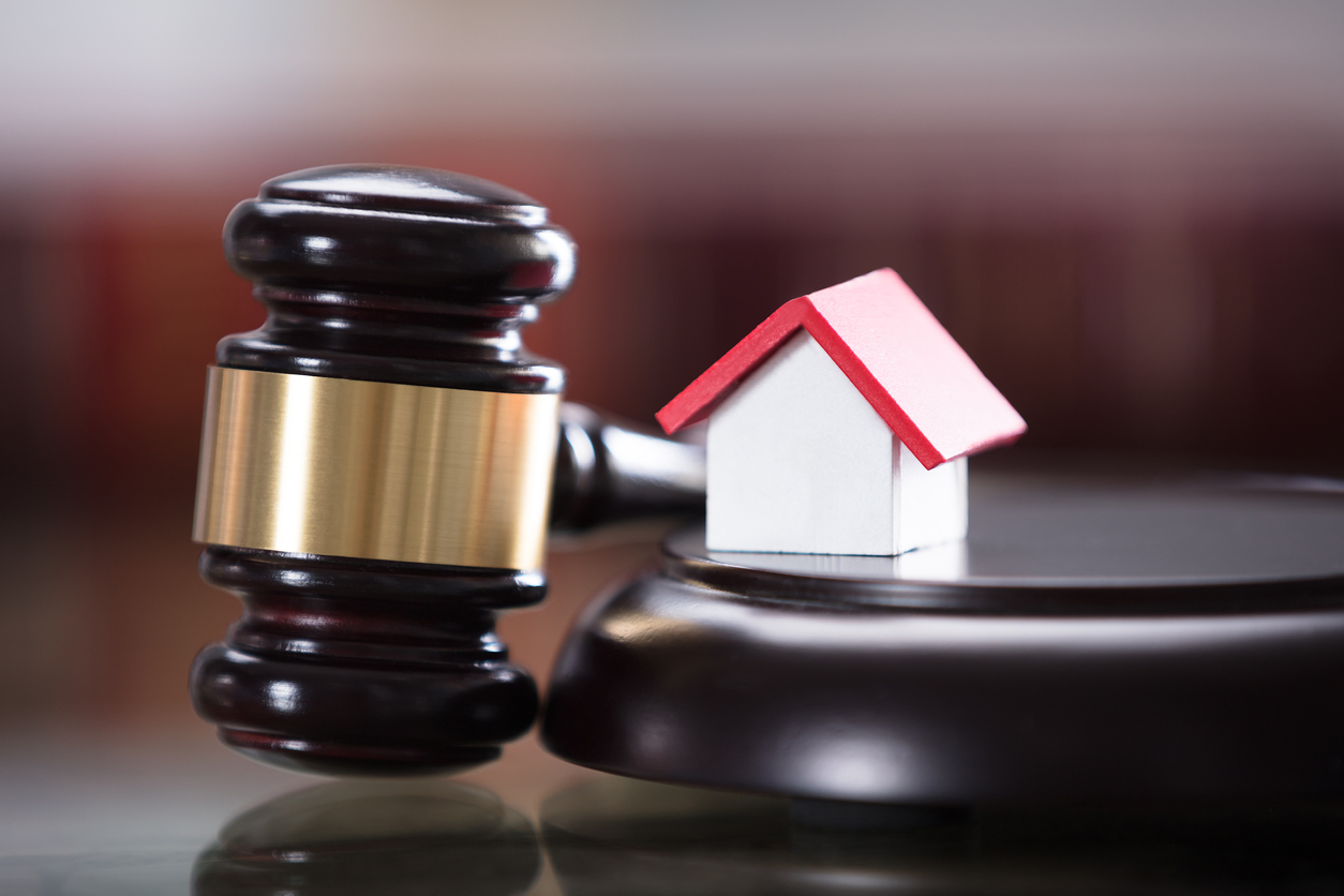 Gavel with a home - Divorce services with OC Paralegal.