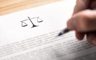 Man writing document with scale icon and sign with pen.