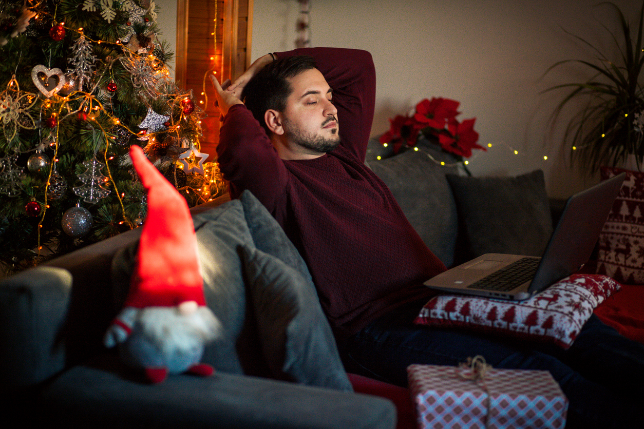 Man relaxing on couch - Background Image